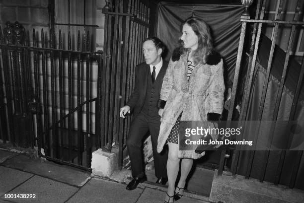 Canadian Prime Minister Pierre Trudeau leaving Annabel's nightclub with his girlfriend, London, UK, 7th January 1969.