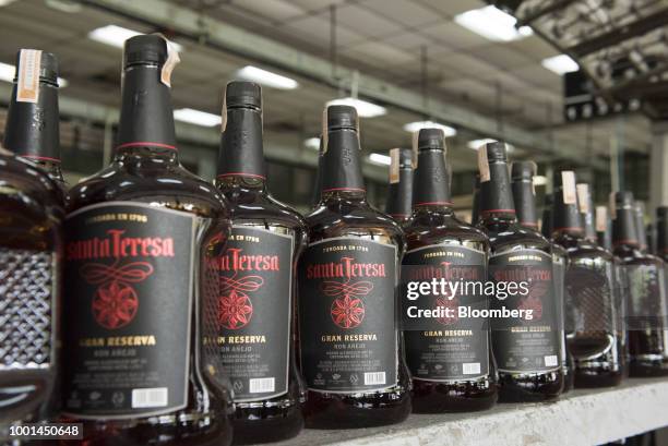 Sealed bottles of rum sit at the Ron Santa Teresa SACA distillery in El Consejo, Aragua state, Venezuela, on Tuesday, July 17, 2018. Once famed...