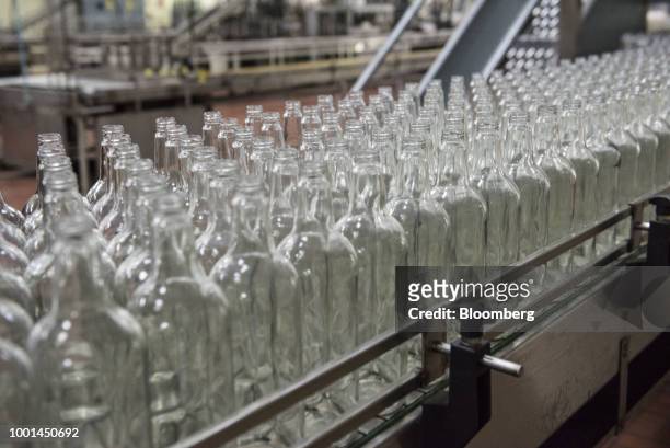 Empty bottles move on a conveyor belt at the Ron Santa Teresa SACA distillery in El Consejo, Aragua state, Venezuela, on Tuesday, July 17, 2018. Once...