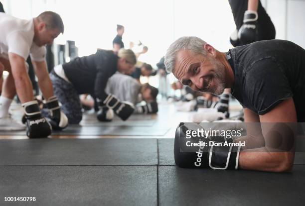 Dr Andrew Rochford takes a quick breather as Sam Wood conducts a boxing class at Paramount Recreation Club on July 19, 2018 in Sydney, Australia.