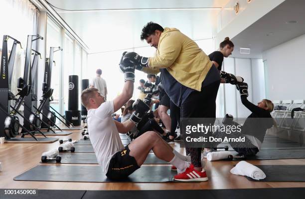Drew Mitchell and Arnott Olsen perform various exercises as Sam Wood conducts a boxing class at Paramount Recreation Club on July 19, 2018 in Sydney,...