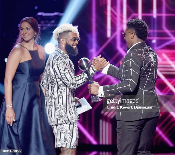 Actor Jessica Szohr and NFL player Odell Beckham Jr. Present the award to NBA player Donovan Mitchell onstage at The 2018 ESPYS at Microsoft Theater...