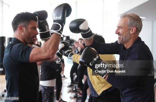 Sam Wood puts Dr Andrew rochford through his paces as he conducts a boxing class at Paramount Recreation Club on July 19, 2018 in Sydney, Australia.