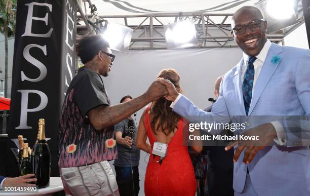 Basketball player Nick Young and retired football player Terrell Owens attend the 2018 ESPY Awards Red Carpet Show Live! Celebrates With Moet &...