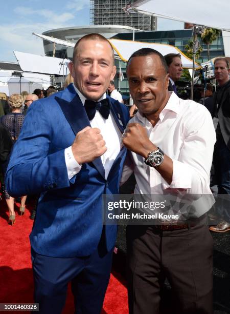 Retired boxer Sugar Ray Leonard and MMA fighter Georges St. Pierre attend the 2018 ESPY Awards Red Carpet Show Live! Celebrates With Moet & Chandon...