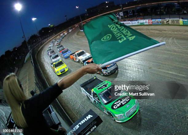 Ben Rhodes, driver of the The Carolina Nut Co. Ford, takes the green flag to start the NASCAR Camping World Truck Series Eldora Dirt Derby at Eldora...