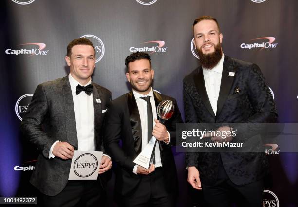 Players Alex Bregman, Jose Altuve and Dallas Keuchel of the Houston Astros pose with the award for Best Team during The 2018 ESPYS at Microsoft...