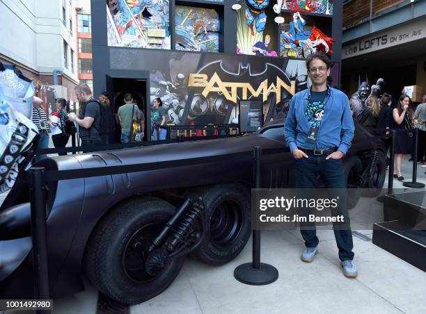 Craig Hunegs poses with the Batmissile Batmobile during The DC UNIVERSE Experience at Comic-Con International: Preview Event on July 18, 2018 in San...