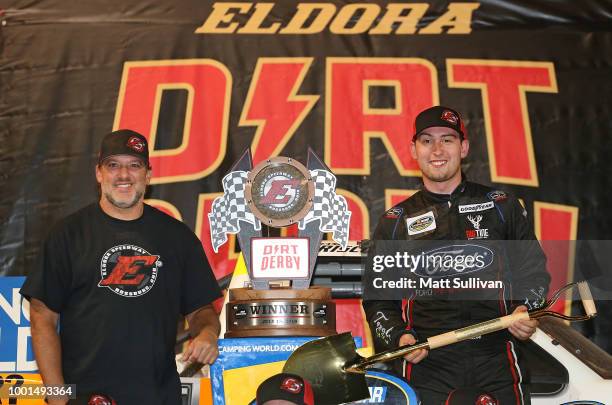 Chase Briscoe, driver of the Ford Ford, and track owner Tony Stewart pose with the trophy after the NASCAR Camping World Truck Series Eldora Dirt...