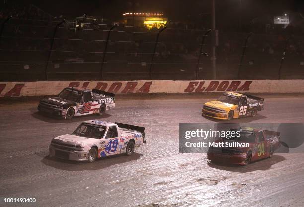 Wendell Chavous, driver of the SobrietyNation.org Chevrolet, leads a pack of trucks during the NASCAR Camping World Truck Series Eldora Dirt Derby at...