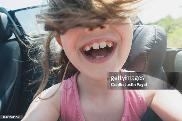 young girl in convertible car - automobile and fun stockfoto's en -beelden