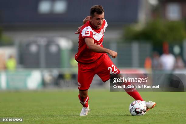 Kevin Stoeger of Duesseldorf runs with the ball during the Pre Season Friendly match between FC Wegberg-Beeck and Fortuna Duesseldorf at Waldstadion...