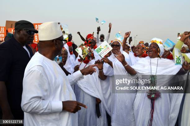 Supporters of Malian incumbent president Ibrahim Boubacar Keita gather at the Gao stadium on July 18, 2018 for a presidential campaign rally.