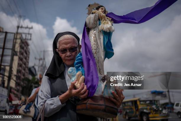 Small group of clergy and civil society members hold a procession with crosses and a coffin to signify the death of democracy under President Duterte...