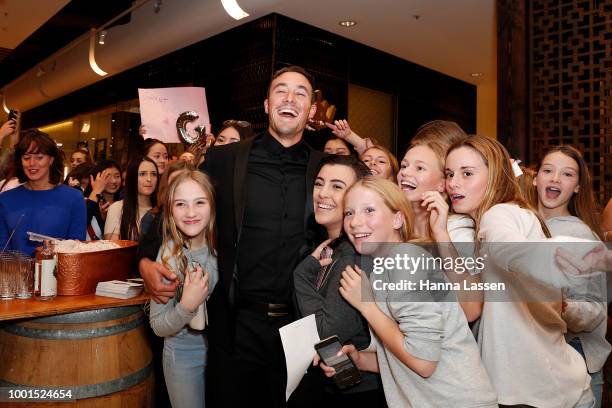 Grant Crapp poses with fans at the ManCave Barbershop Chatswood Chase Launch on July 19, 2018 in Sydney, Australia.