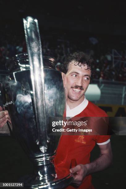 Liverpool player Alan Kennedy celebrates with the trophy after scoring the winning goal in the 1981 European Cup Final against Real Madrid at Parc...