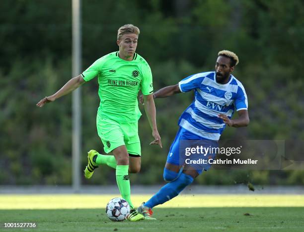 Timo Huebers of Hannover and Pierre Merkel of Wacker Nordhausen battles for the ball during the pre-season friendly match between Hannover 96 and FSV...