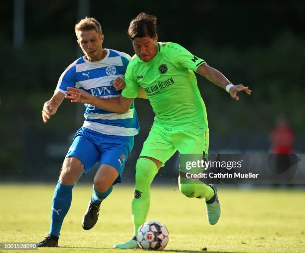 Miiko Albornoz of Hannover and Florian Beil of Wacker Nordhausen battles for the ball during the pre-season friendly match between Hannover 96 and...