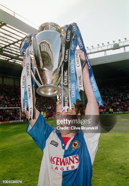 Blackburn Rovers striker Alan Shearer pictured with the Carling Premiership trophy after the match against Liverpool at Anfield on May 14, 1995 in...