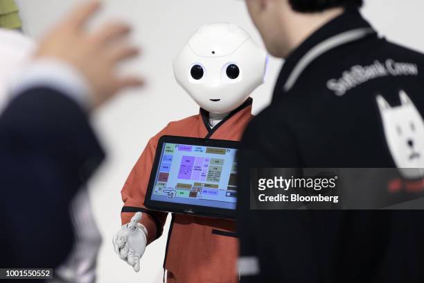 SoftBank Group Corp. Pepper humanoid robot stands at the SoftBank World 2018 event in Tokyo, Japan, on Thursday, July 19, 2018. SoftBank and...