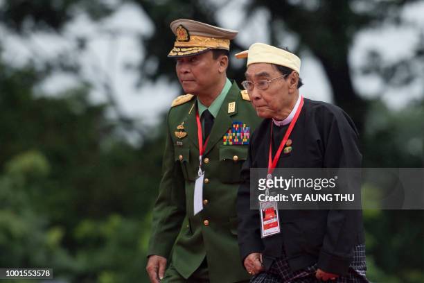 Myanmar's home minister Lieutenant general Kyaw Swe and ethnic affairs minister Naing Thet Lwin arrive to pay their respects to country's...