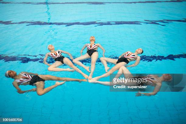 girls practicing - synchronized swimming stock pictures, royalty-free photos & images