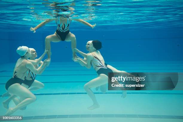 girls practicing - synchronized swimming stock pictures, royalty-free photos & images