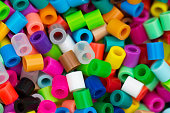 Close up of perler beads in different colors