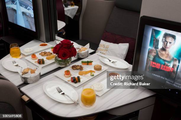 Business Class meals and luxury seating in a Qatar Airways Airbus A350-1000 at the Farnborough Airshow, on 18th July 2018, in Farnborough, England.