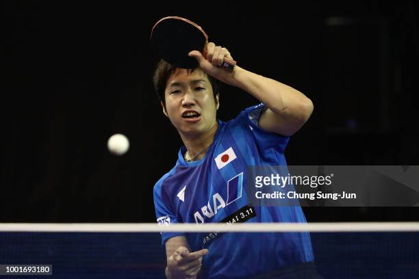 Jun Mizutani of Japan competes against Ning Gao of China in the Men's Single on day one of the Shinhan Korea Open at Daejeon Hanbat Stadium on July...