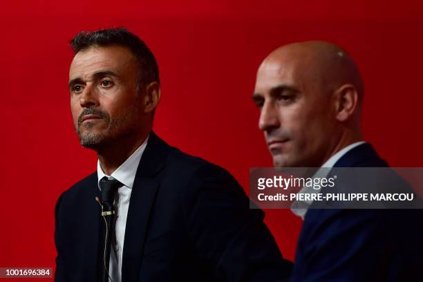Spain's new coach Luis Enrique talks to the press next to Spanish football federation president Luis Rubiales during his during his official...