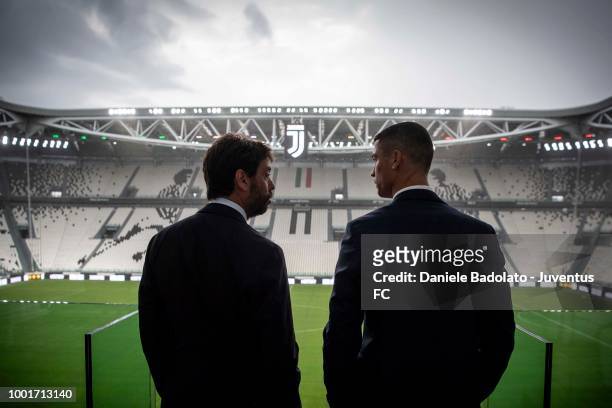 Juventus new signing Cristiano Ronaldo and Juventus president Andrea Agnelli look on before attending a press conference on July 16, 2018 in Turin,...