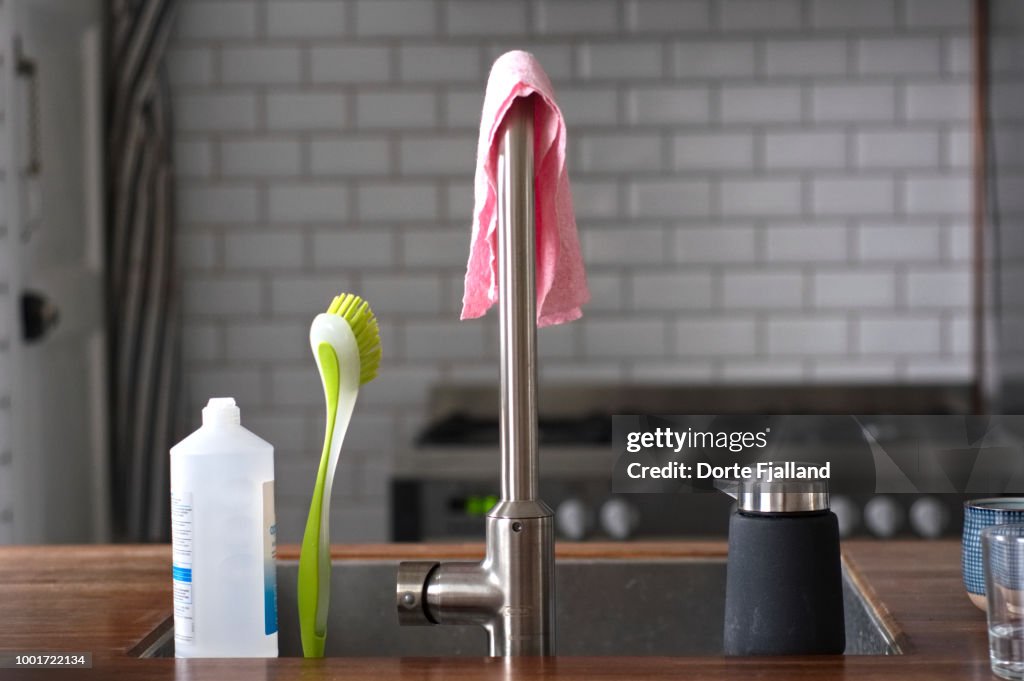 Kitchen counter with soaps and brushes