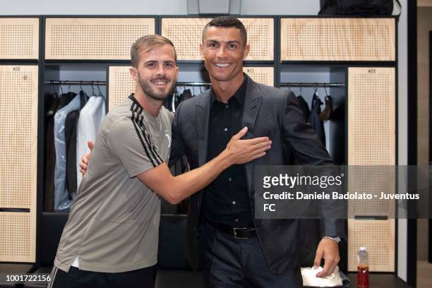 Juventus new signing Cristiano Ronaldo poses with team mate Miralem Pjanic on July 16, 2018 in Turin, Italy.