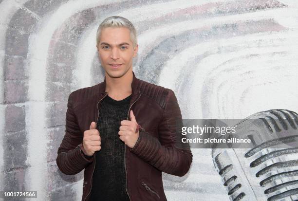 Singer and actor Julian David attends the fashion presentation of label 'Riani' during the Mercedes-Benz Fashion Week Berlin at Umspannwerk Mitte in...