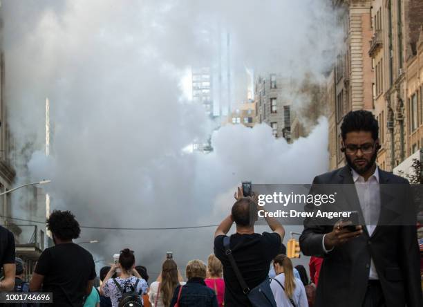 Steam rises near the site of a steam pipe explosion on Fifth Avenue near the Flatiron District on July 19, 2018 in New York City. Buildings were...