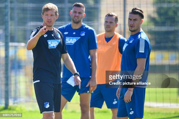 Hoffenheim's manager Julian Nagelsmann instructs his players at a training session in the Dietmar Hopp Sports Park in Zuzenhausen, Germany, 5 July...