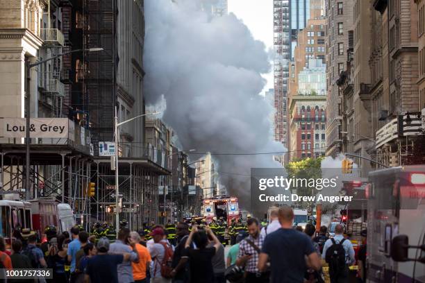 Steam rises near the site of a steam pipe explosion on Fifth Avenue near the Flatiron District on July 19, 2018 in New York City. Buildings were...