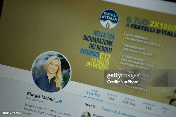 The twitter profile of the extreme right Fratelli d'Italia leader Giorgia Meloni is seen on a screen.
