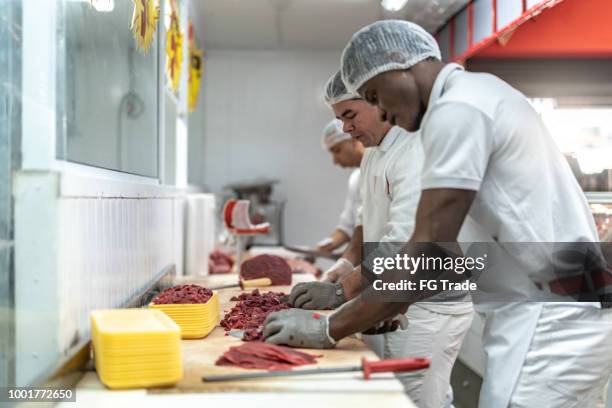 group of people working at the butchery - pork cuts stock pictures, royalty-free photos & images