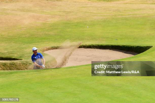 Zach Johnson of the United States plays out a bunker on the 8th hole during round one of the 147th Open Championship at Carnoustie Golf Club on July...