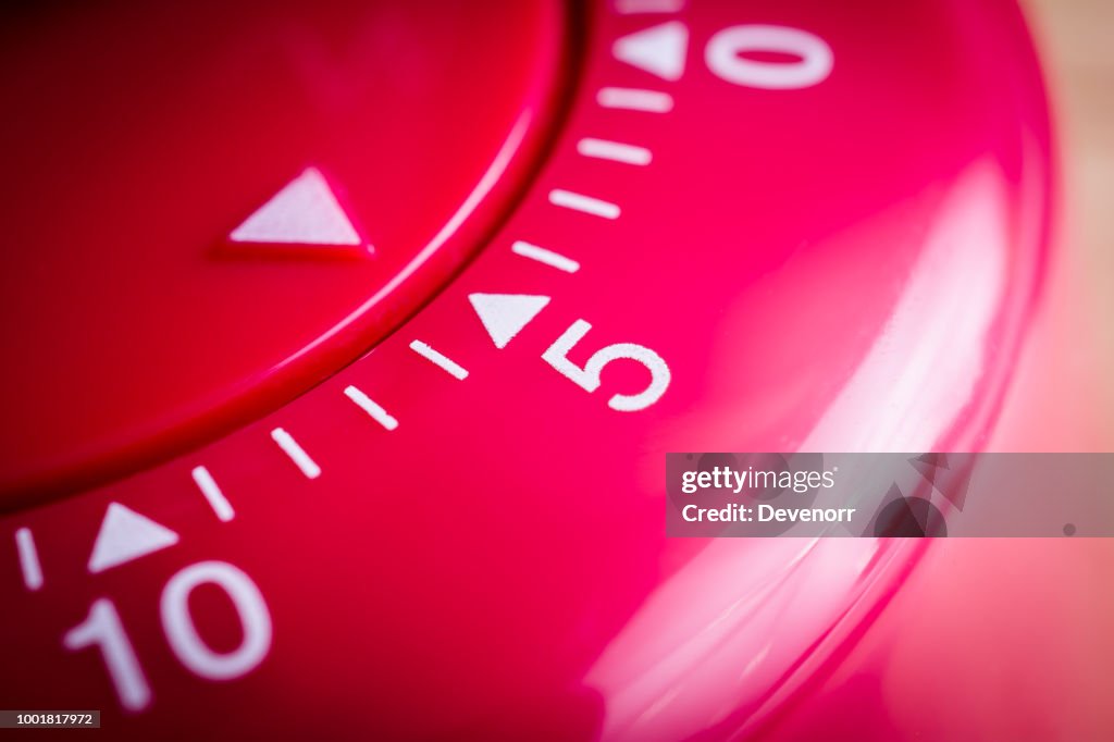 5 Minutes - Macro Of A Flat Red Kitchen Egg Timer