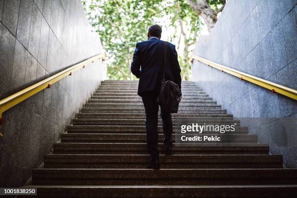 bilfria affärsman går ut ur metro - steps and staircases bildbanksfoton och bilder