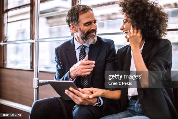 colleagues out of work in tram - milan tram stock pictures, royalty-free photos & images