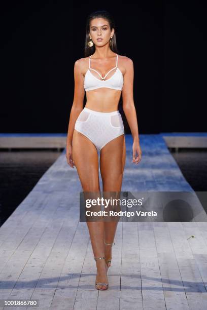 Model walks the runway for Aqua Blu during the Fashion Palette Miami Australian Swim Show SS19 at The Setai Miami Beach on July 15, 2018 in Miami...