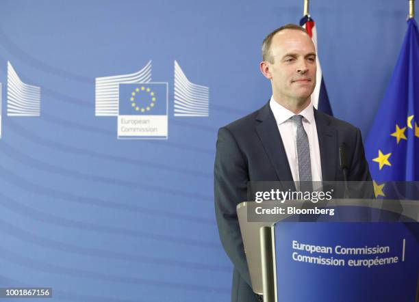 Dominic Raab, U.K. Exiting the European Union secretary, stands at a podium ahead of the resumption of Brexit talks at the Berlaymont building in...