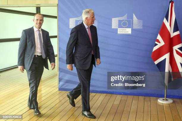 Dominic Raab, U.K. Exiting the European Union secretary, left, and Michel Barnier, chief negotiator for the European Union , arrive to deliver...