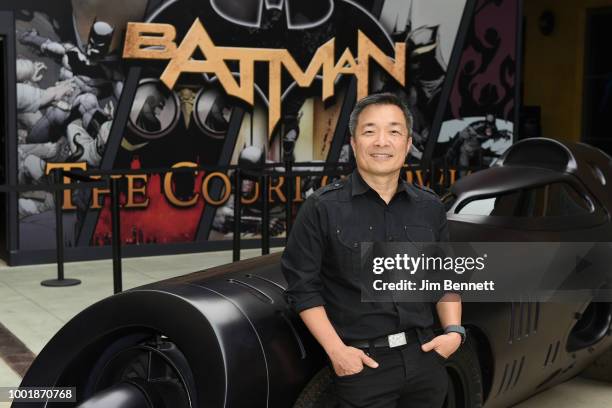 Jim Lee, CCO and Publisher of DC, poses with the Batmissile Batmobile at The DC UNIVERSE Experience at Comic-Con International on July 19, 2018 in...