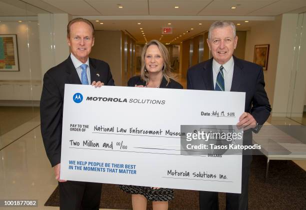 Cathy Seidel, Vice President of Government Affairs, Motorola Solutions , presents $2 million in funding to the National Law Enforcement Museum,...