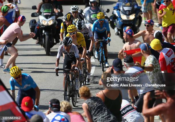 Geraint Thomas of Great Britain and Team Sky wearing the yellow jersey climbs up Alpe d'Huez on his way to victory during Stage 12, a 175.5km stage...